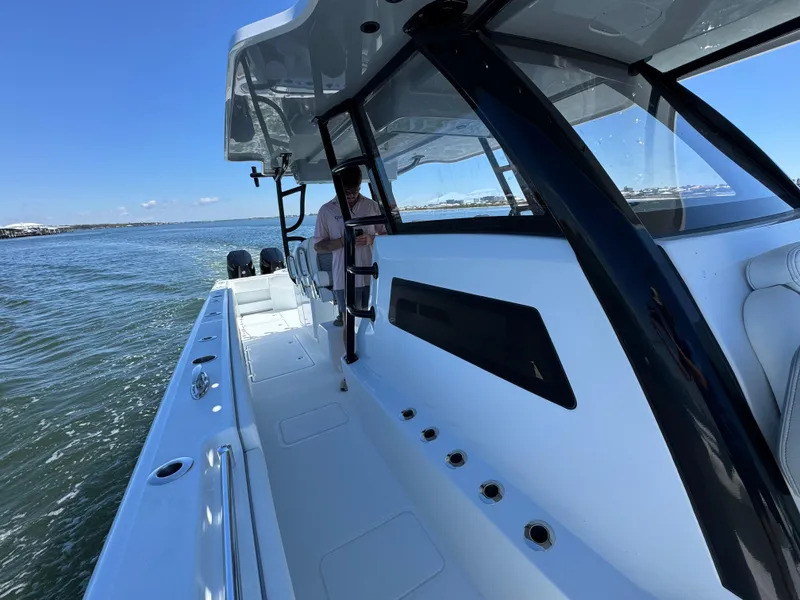 Slide: The Image of 2025 Invincible 40 Catamaran cruising on open water, showcasing sleek design and spacious deck. - 28