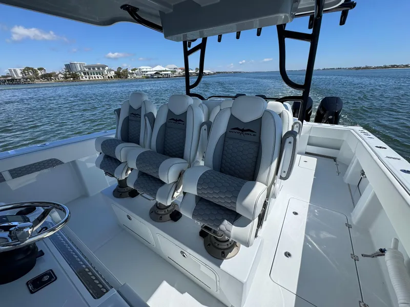 Slide: The Image of 2025 Invincible 40 Catamaran interior with luxurious seating on a sunny day. - 29