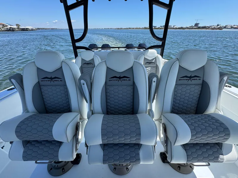 Slide: The Image of Luxury seating on 2025 Invincible 40 Catamaran, featuring sleek design and waterfront view. - 30