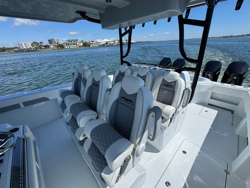 Slide: The Image of Luxurious seating on 2025 Invincible 40 Catamaran, with ocean view in the background. - 31