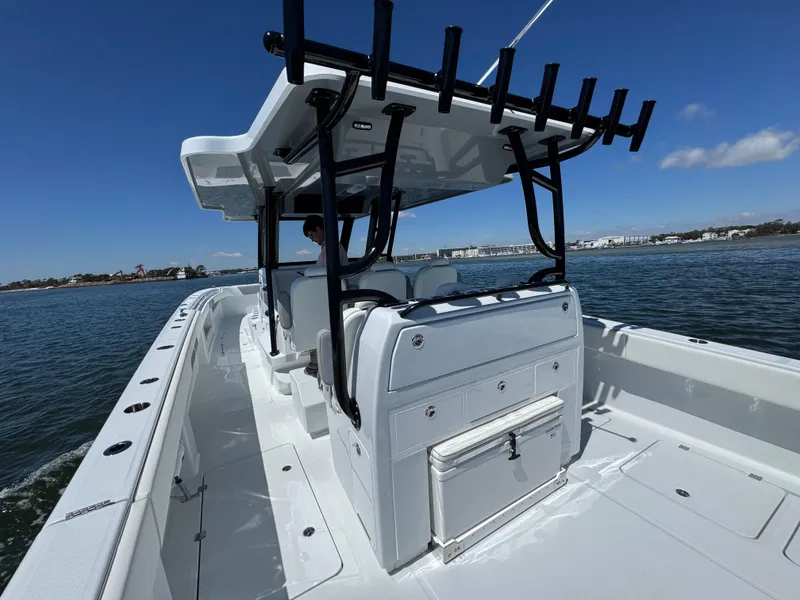 Slide: The Image of 2025 Invincible 40 Catamaran on water, showcasing sleek design and spacious deck. - 35