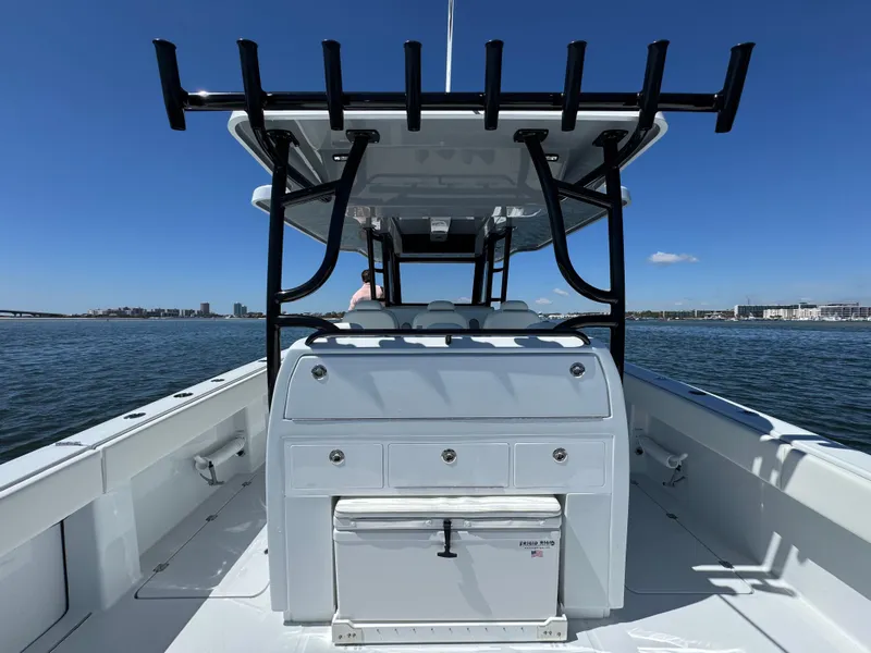 Slide: The Image of 2025 Invincible 40 Catamaran on water, featuring sleek design and spacious deck. - 36