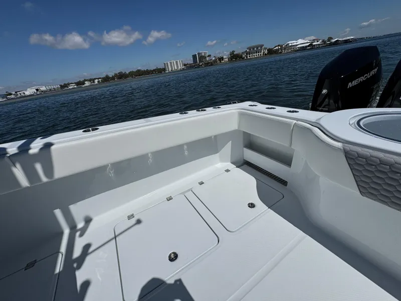 Slide: The Image of 2025 Invincible 40 Catamaran deck with ocean view and Mercury engines. - 39