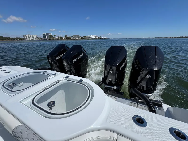 Slide: The Image of 2025 Invincible 40 Catamaran with four Mercury engines on water. - 41