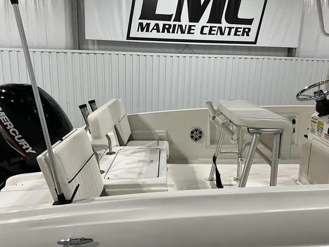 Slide: The Image of 2021 Bayliner T21BAY boat interior with seating and Mercury engine at LMC Marine Center. - 11