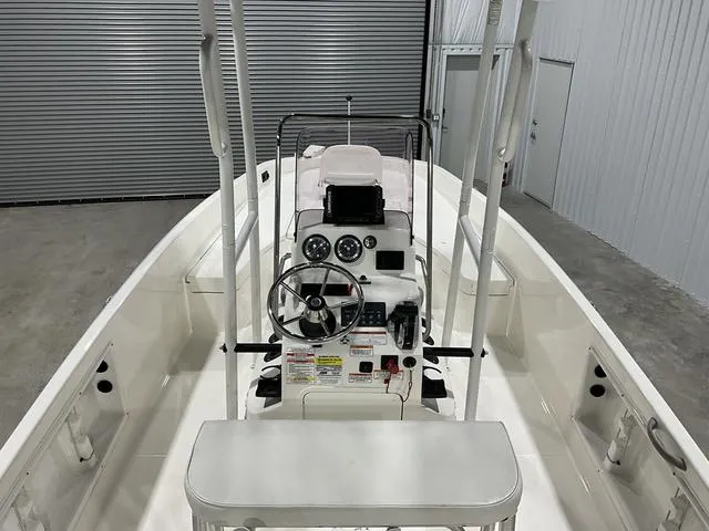 Slide: The Image of 2021 Bayliner T21BAY boat interior with steering console in a storage facility. - 12