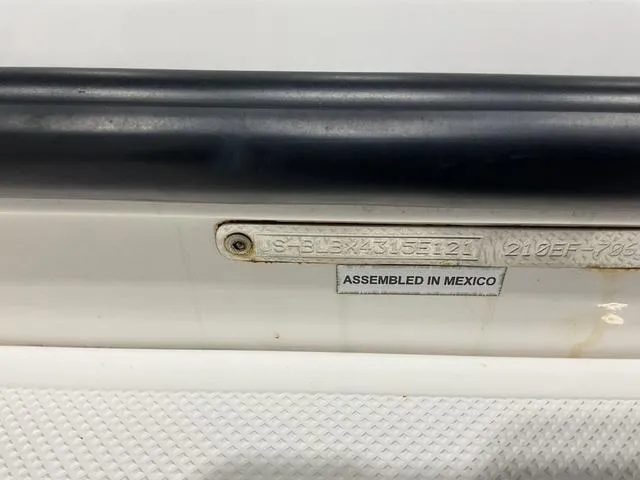 Slide: The Image of Bayliner T21BAY 2021 boat, assembled in Mexico, with visible identification plate. - 17