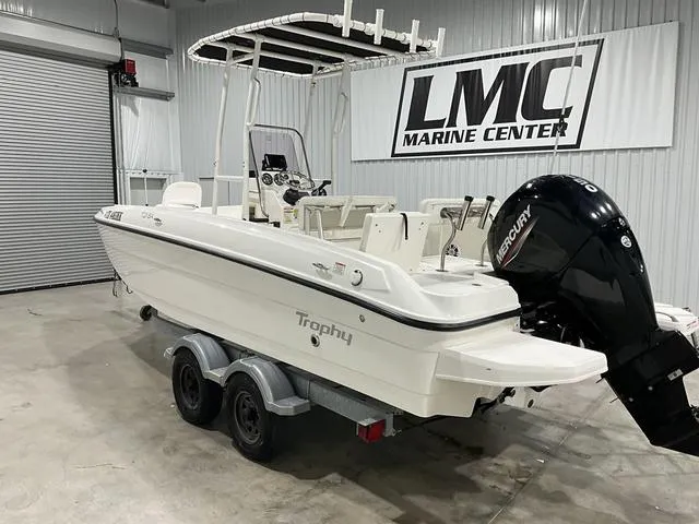 Slide: The Image of 2021 Bayliner T21BAY boat in showroom, featuring Mercury outboard motor. - 3