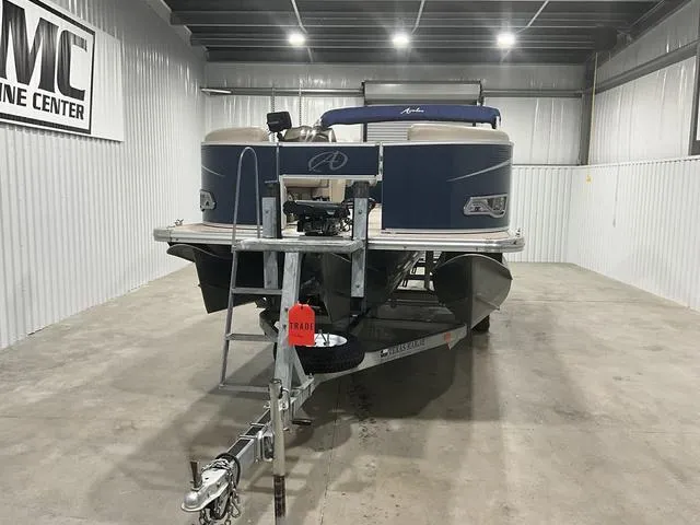 Slide: The Image of 2019 Avalon 22 LSZ pontoon boat on trailer in indoor storage facility. - 2