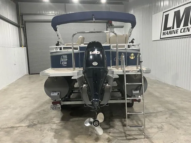Slide: The Image of 2019 Avalon 22 LSZ pontoon boat with 140 HP engine in a marine center. - 3