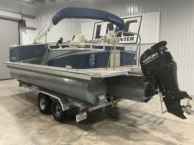 Slide: The Image of 2019 Avalon 22 LSZ pontoon boat with Suzuki 140 outboard motor in a showroom. - 5