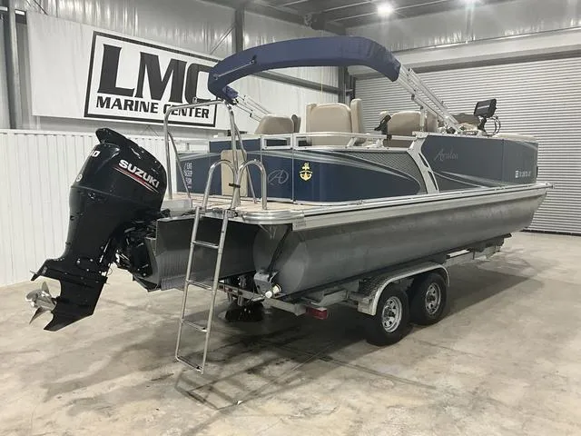 Slide: The Image of 2019 Avalon 22 LSZ pontoon boat with Suzuki outboard motor in a marine center. - 7
