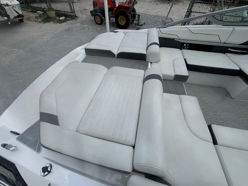 Slide: The Image of 2016 Regal 2100 RX Bowrider interior with white cushioned seating. - 12