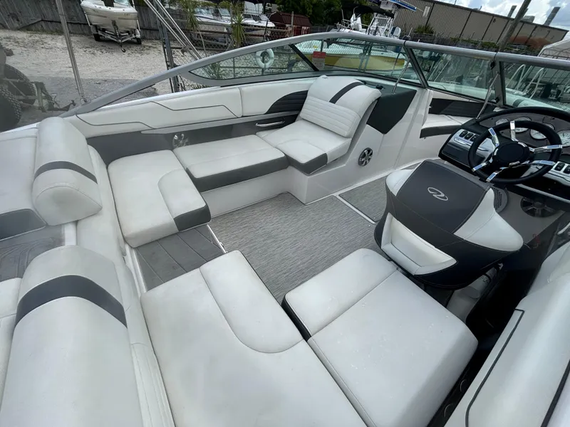 Slide: The Image of 2016 Regal 2100 RX Bowrider interior with plush seating and modern dashboard. - 14