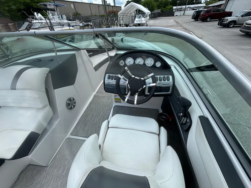 Slide: The Image of 2016 Regal 2100 RX Bowrider interior with steering wheel and dashboard controls. - 15