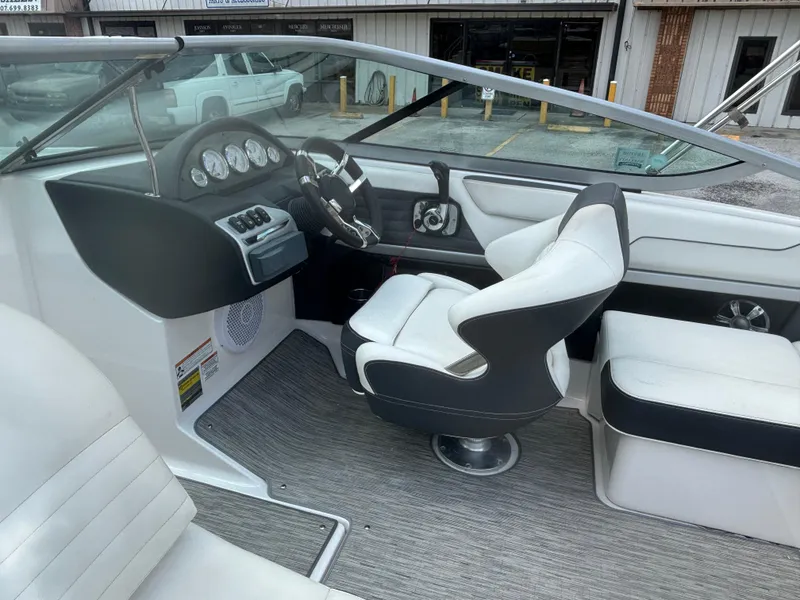 Slide: The Image of 2016 Regal 2100 RX Bowrider interior with sleek dashboard and comfortable seating. - 16