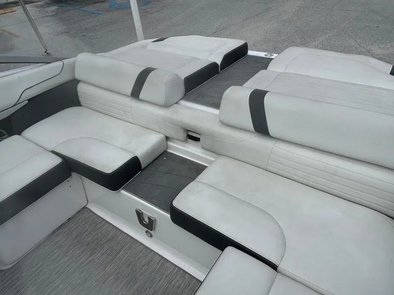 Slide: The Image of 2016 Regal 2100 RX Bowrider interior with white and gray seating arrangement. - 17