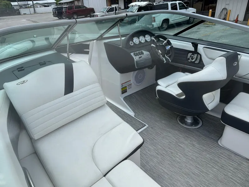 Slide: The Image of 2016 Regal 2100 RX Bowrider interior with white seating and modern dashboard. - 18