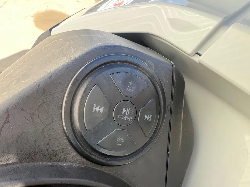 Slide: The Image of Control panel of 2019 Sea-Doo Fish Pro 155 with power and volume buttons. - 14