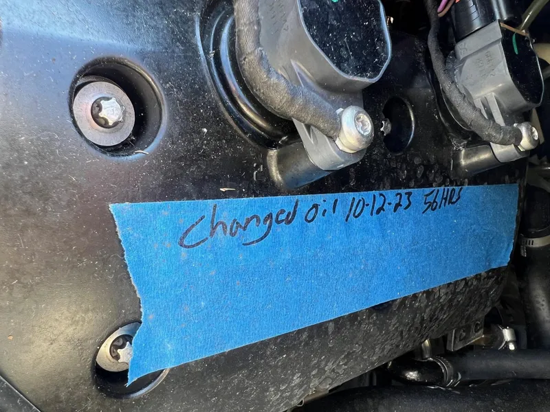 Slide: The Image of 2019 Sea-Doo Fish Pro 155 engine with oil change note on blue tape. - 19