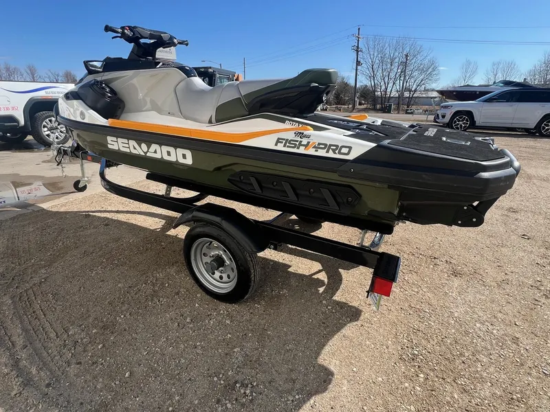 Slide: The Image of 2019 Sea-Doo Fish Pro 155 on trailer, parked outdoors on a sunny day. - 2