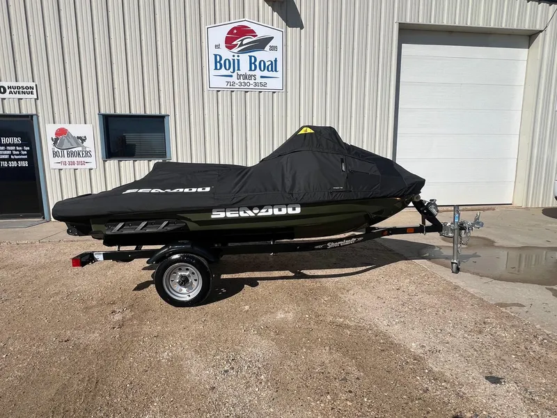 Slide: The Image of 2019 Sea-Doo Fish Pro 155 on trailer, covered, outside Boji Boat Brokers. - 21