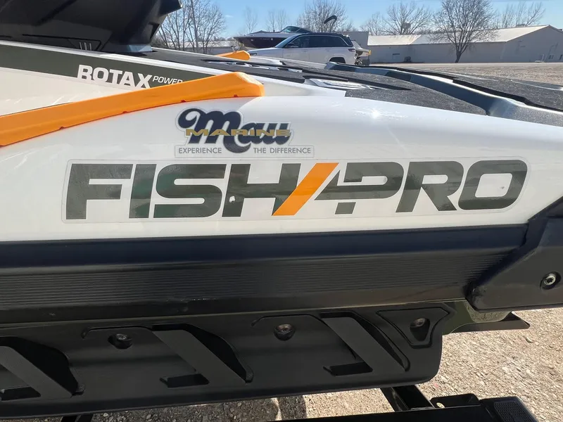Slide: The Image of 2019 Sea-Doo Fish Pro 155 with Rotax power branding, parked outdoors. - 4