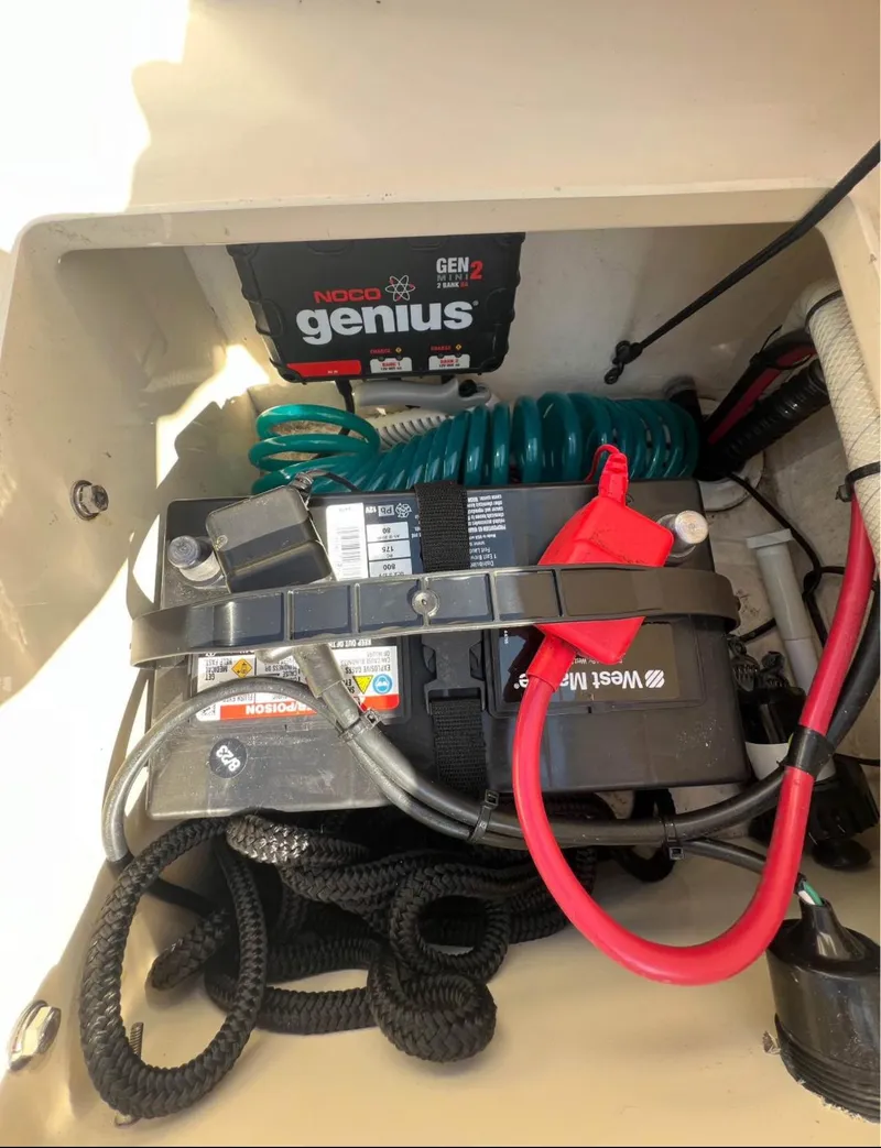 Slide: The Image of Battery compartment of 2008 Parker 2120 Sport Cabin with NOCO Genius charger. - 15