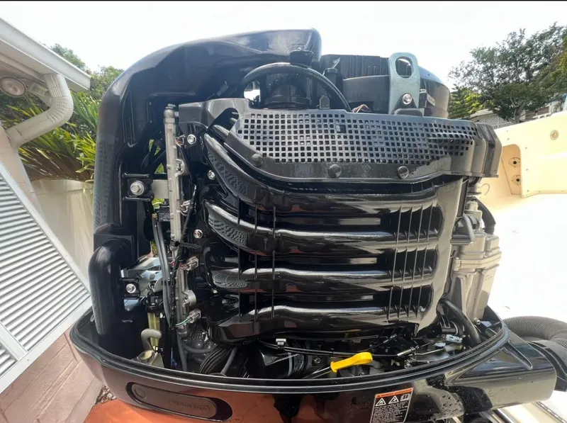 Slide: The Image of Close-up of a Parker 2120 Sport Cabin 2008 boat engine, showcasing intricate mechanical details. - 19