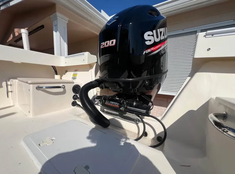 Slide: The Image of 2008 Parker 2120 Sport Cabin boat with Suzuki 200 outboard motor. - 6