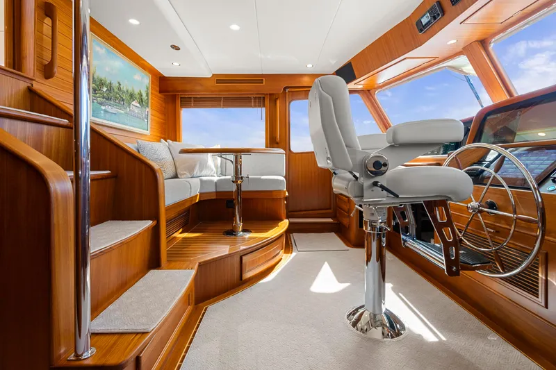 Slide: The Image of Luxurious interior of 2023 Fleming 65 yacht with plush seating and modern helm. - 19