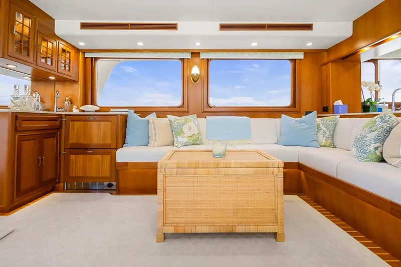 Slide: The Image of Luxurious interior of 2023 Fleming 65 yacht with elegant wood finish and plush seating. - 3