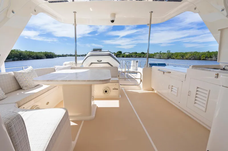 Slide: The Image of Luxurious 2023 Fleming 65 yacht interior with elegant seating and scenic water view. - 40