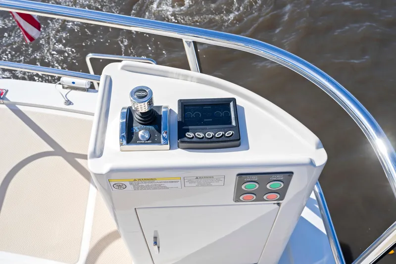 Slide: The Image of Control panel on 2023 Fleming 65 yacht, featuring joystick and display screen. - 42