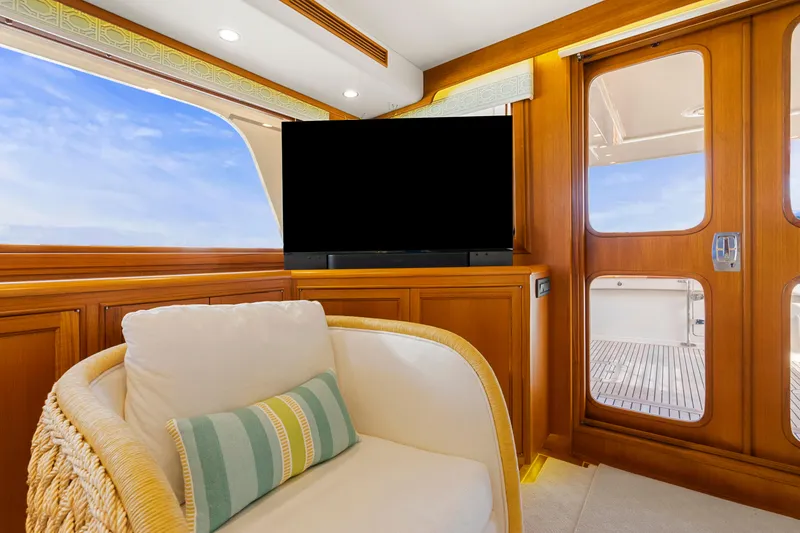 Slide: The Image of Luxurious interior of 2023 Fleming 65 yacht with plush seating and large TV. - 6