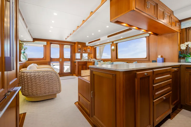 Slide: The Image of Luxurious interior of 2023 Fleming 65 yacht with elegant wood finishes and modern amenities. - 7