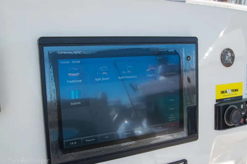 Slide: The Image of Garmin sonar display on 2018 Cobia 240 CC boat dashboard. - 15