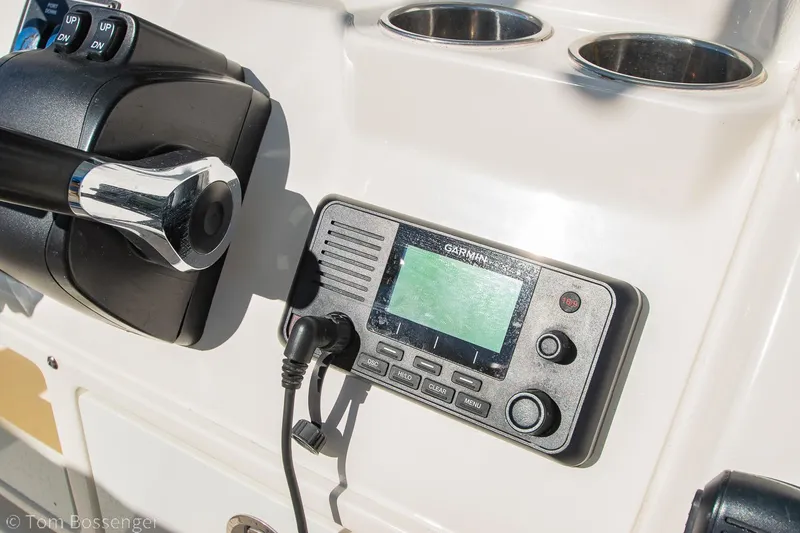 Slide: The Image of Control panel of 2018 Cobia 240 CC boat with Garmin marine radio. - 19