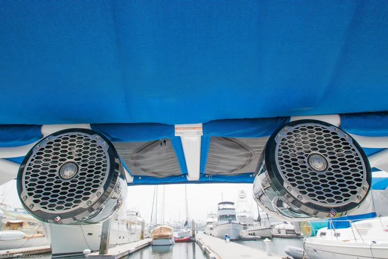 Slide: The Image of 2020 Monterey M4 boat speakers under blue canopy at marina. - 10