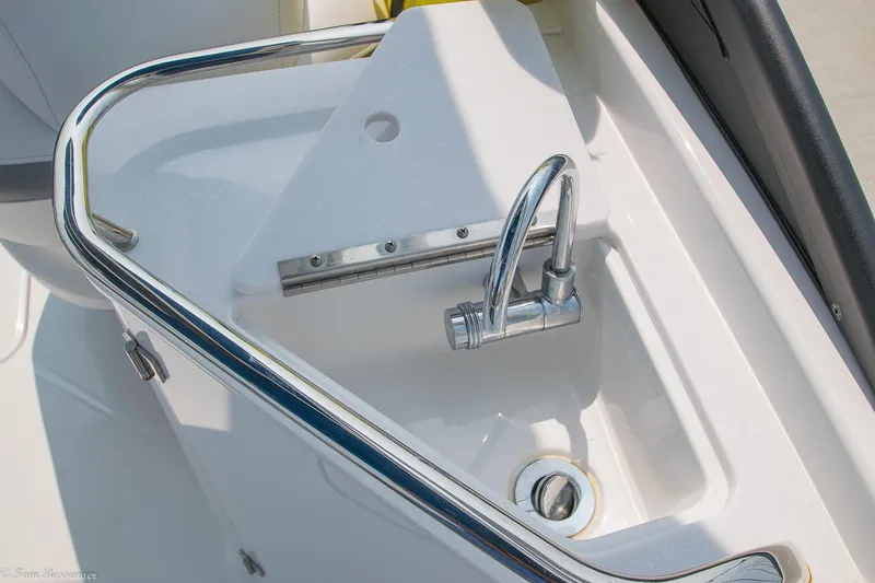Slide: The Image of 2020 Monterey M4 boat sink with chrome faucet and white basin. - 11