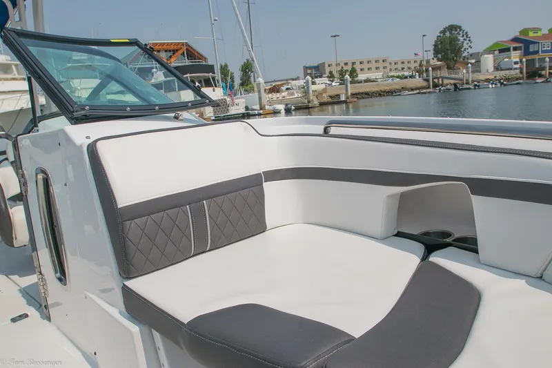 Slide: The Image of 2020 Monterey M4 boat with sleek seating, docked at a marina. - 13