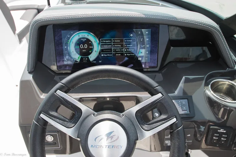 Slide: The Image of Steering wheel and dashboard of 2020 Monterey M4 boat with digital display. - 17