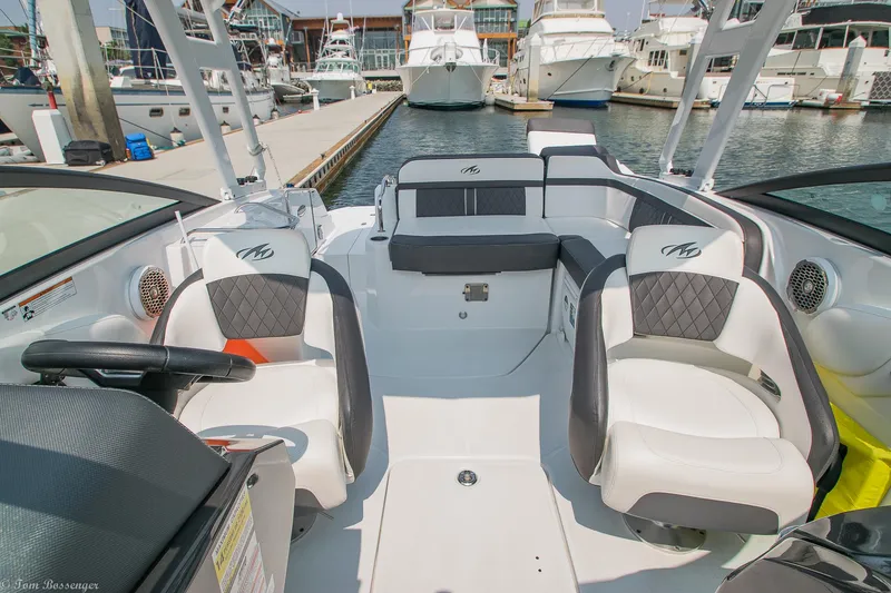 Slide: The Image of Interior of a 2020 Monterey M4 boat docked at a marina with luxury seating. - 23