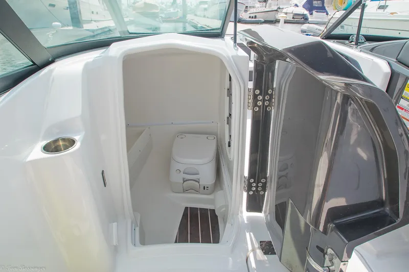 Slide: The Image of 2020 Monterey M4 boat interior with compact marine toilet and sleek design. - 24