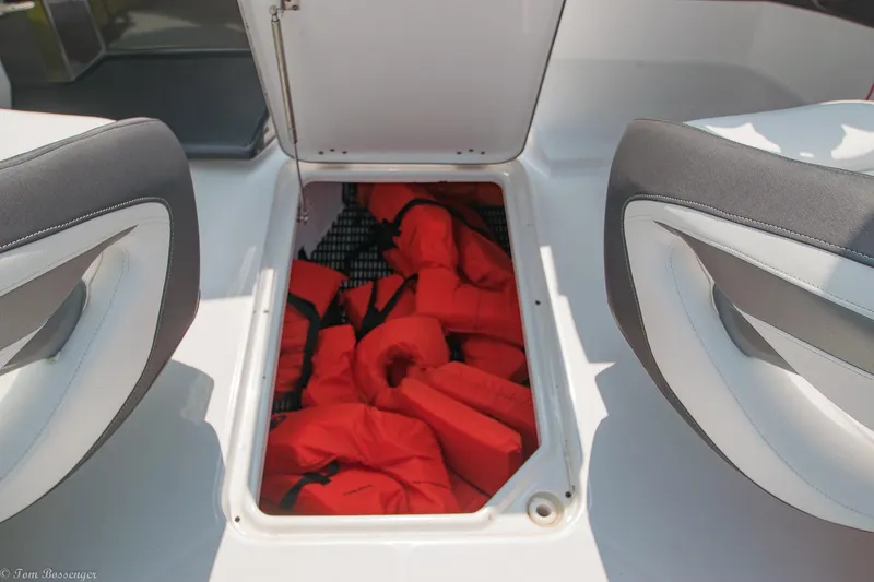 Slide: The Image of Storage compartment with life jackets on a 2020 Monterey M4 boat. - 25