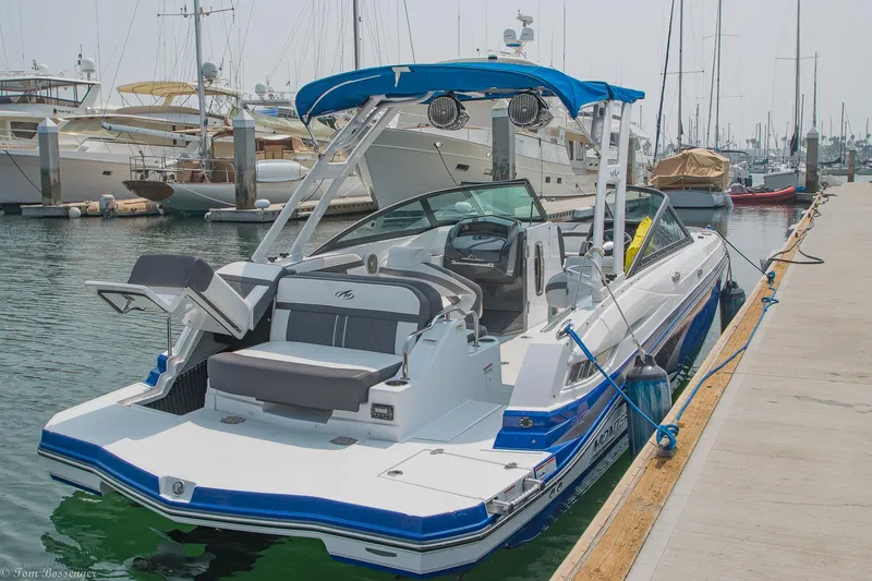 Slide: The Image of 2020 Monterey M4 boat docked at marina, featuring sleek design and blue accents. - 3