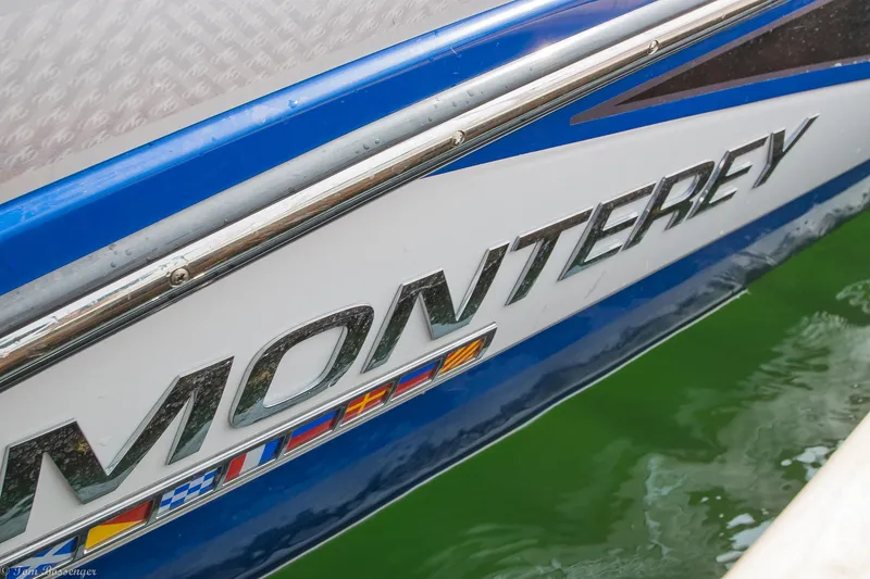 Slide: The Image of Monterey M4 boat, 2020 model, with vibrant blue and white design on water. - 4