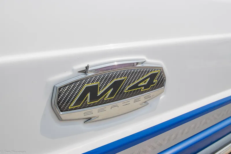 Slide: The Image of Monterey M4 2020 model emblem on white surface with blue accents. - 5