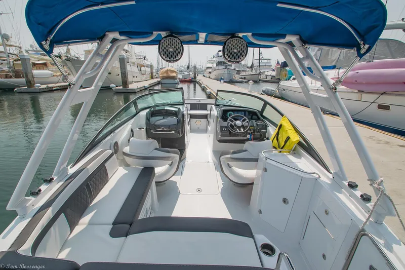 Slide: The Image of 2020 Monterey M4 boat docked at marina, featuring spacious seating and modern design. - 7