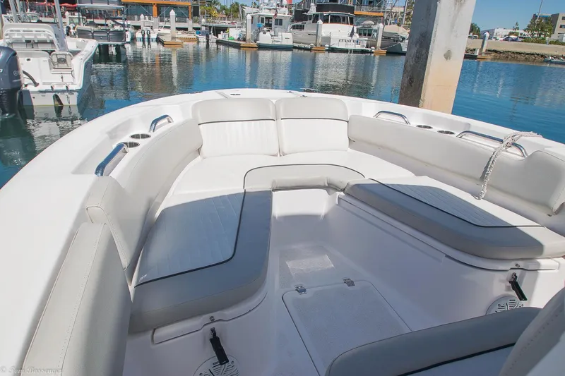 Slide: The Image of 2021 Sea Fox 248 Commander boat with spacious seating in a marina setting. - 17